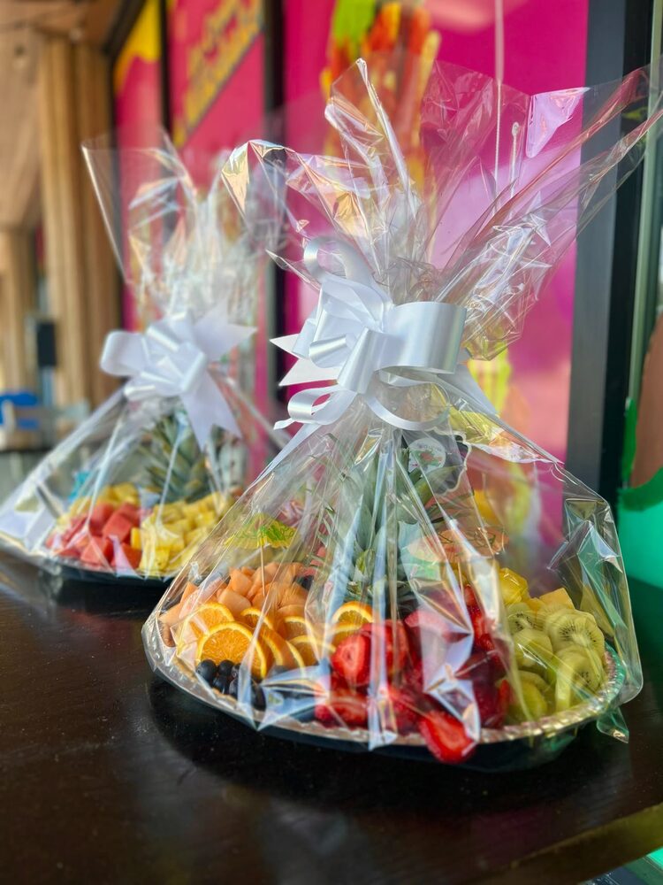 Gift-wrapped fruit trays ready for pickup