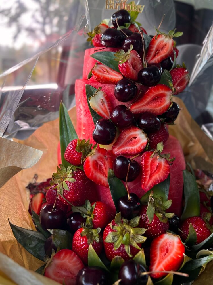 Watermelon and strawberry fruit arrangement with cherries